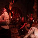 In house red-lit shot of zombies